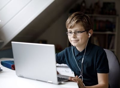 Boy studying on a computer