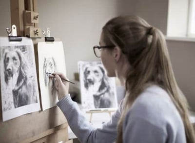 Girl painting a cute dog