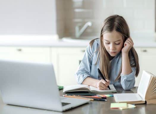 Girl studying concentrated and taking notes